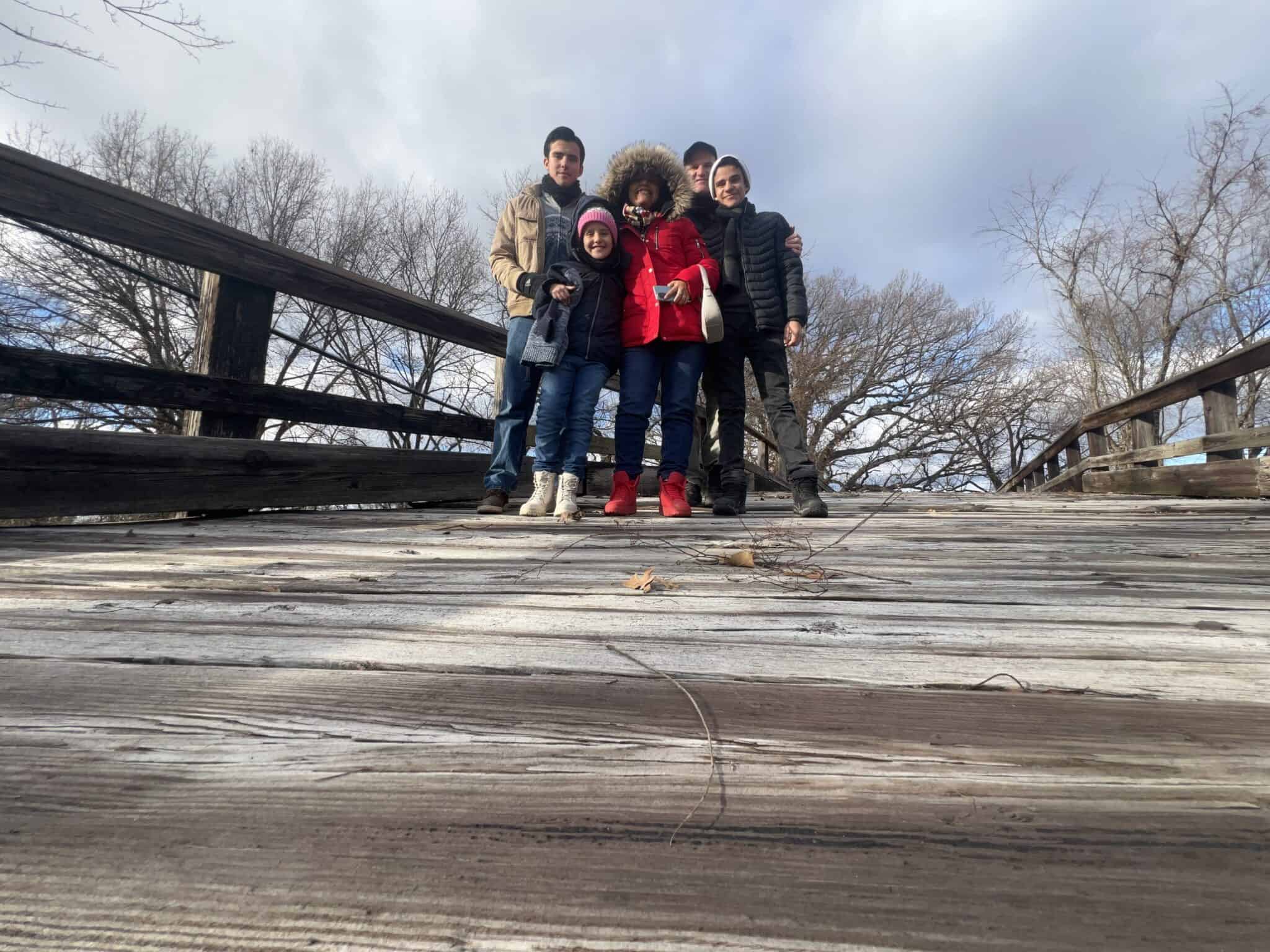 Douglas Favero with his family on a childhood bridge in Illinois