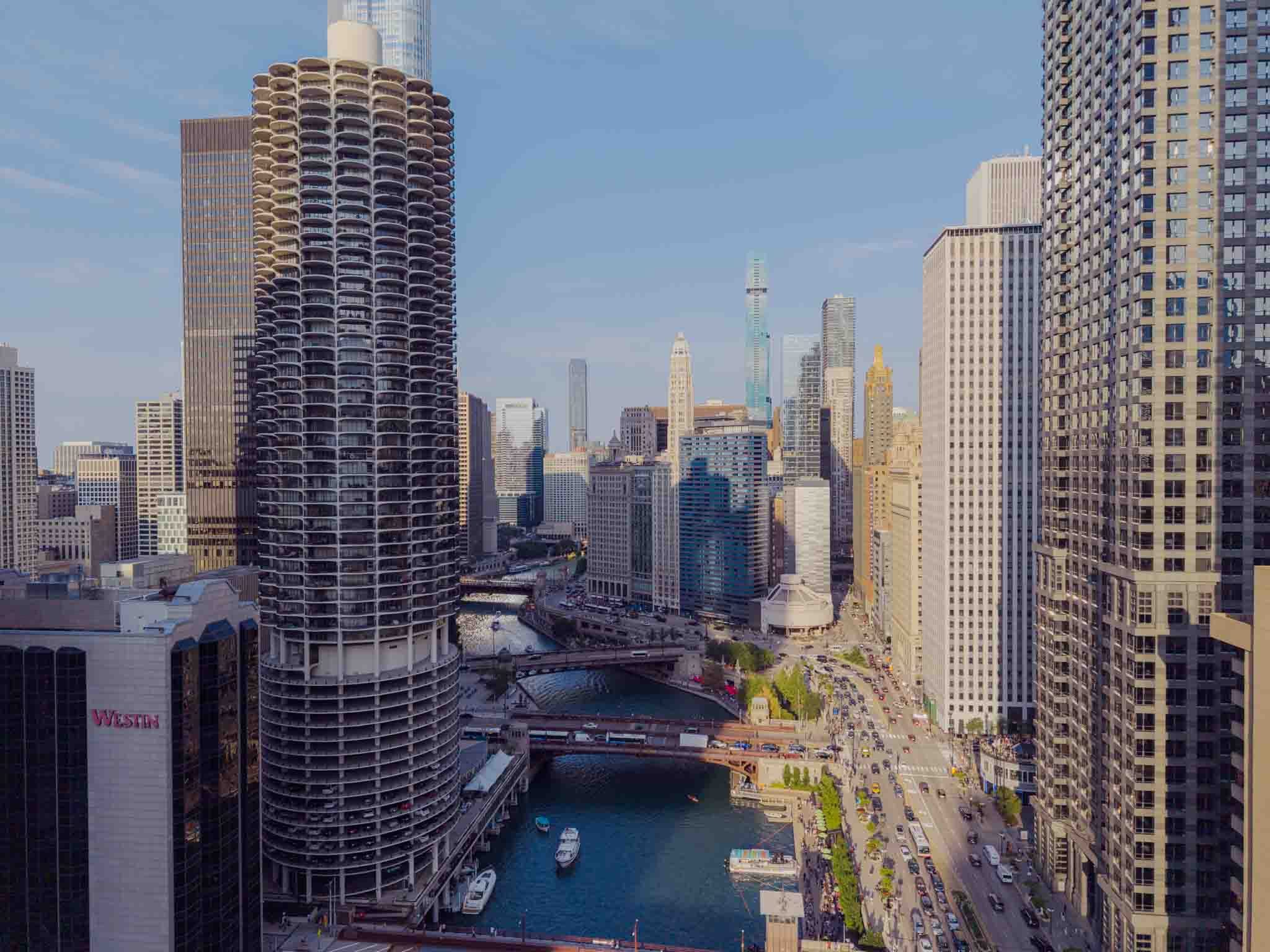 Drone view down the Chicago River past Marina City and the downtown towers