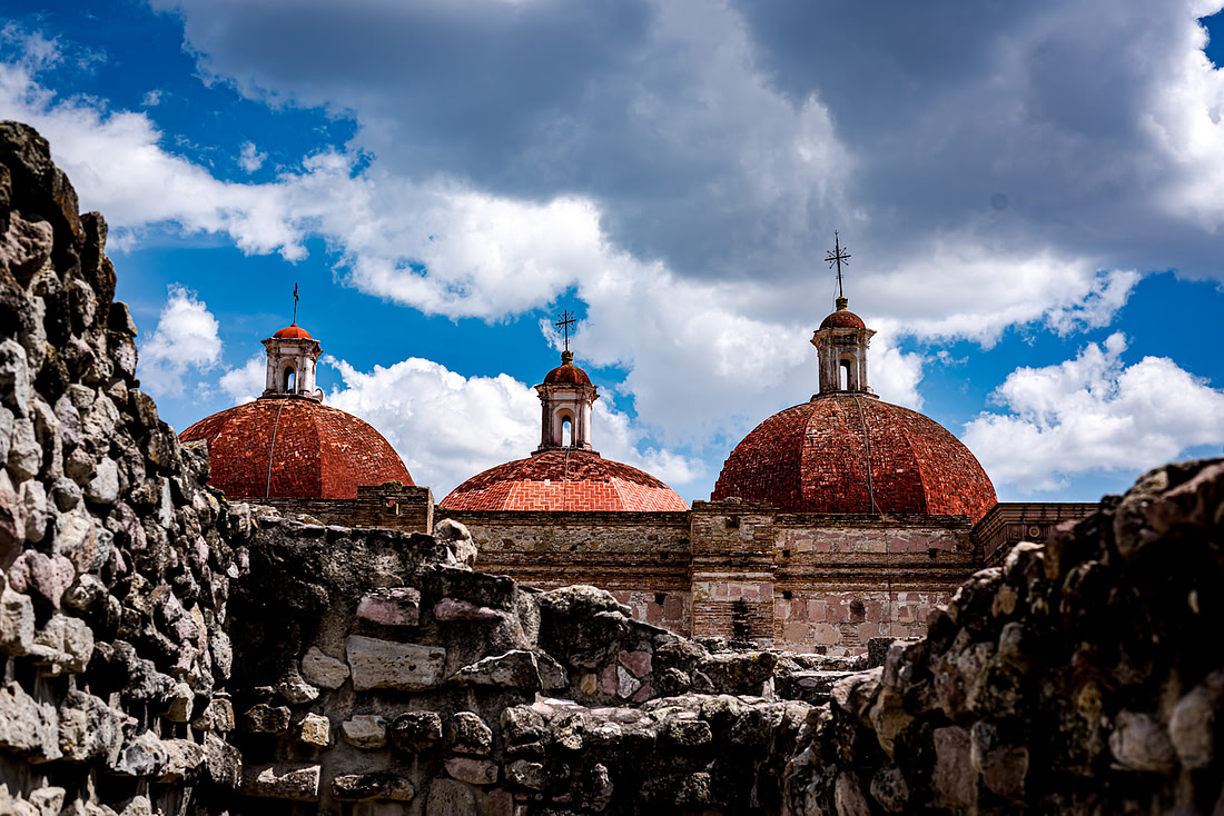 The domed roofline of Mitla’s church rising behind its ancient stone walls