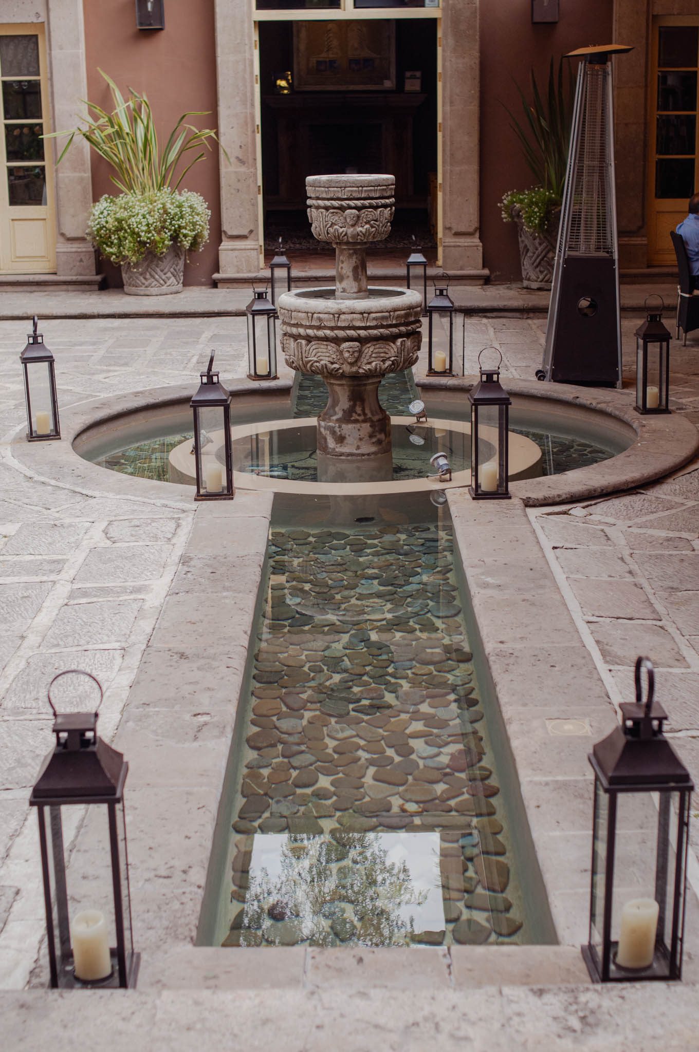 Lanterns and the courtyard fountain at Hotel Boutique Nena