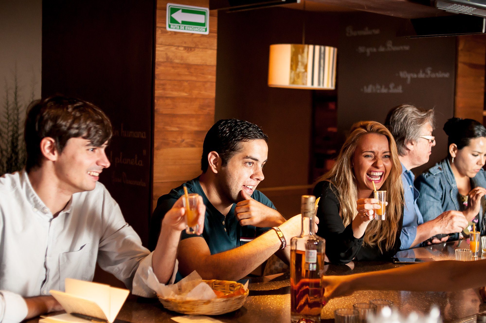 Laughing at a mezcal tasting