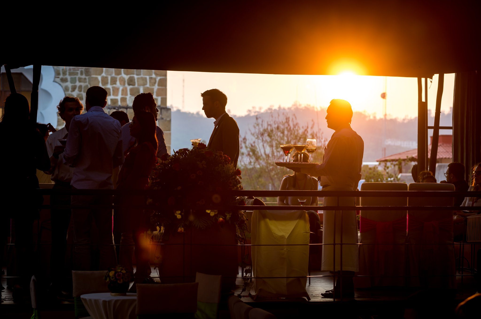 A rooftop reception at sunset