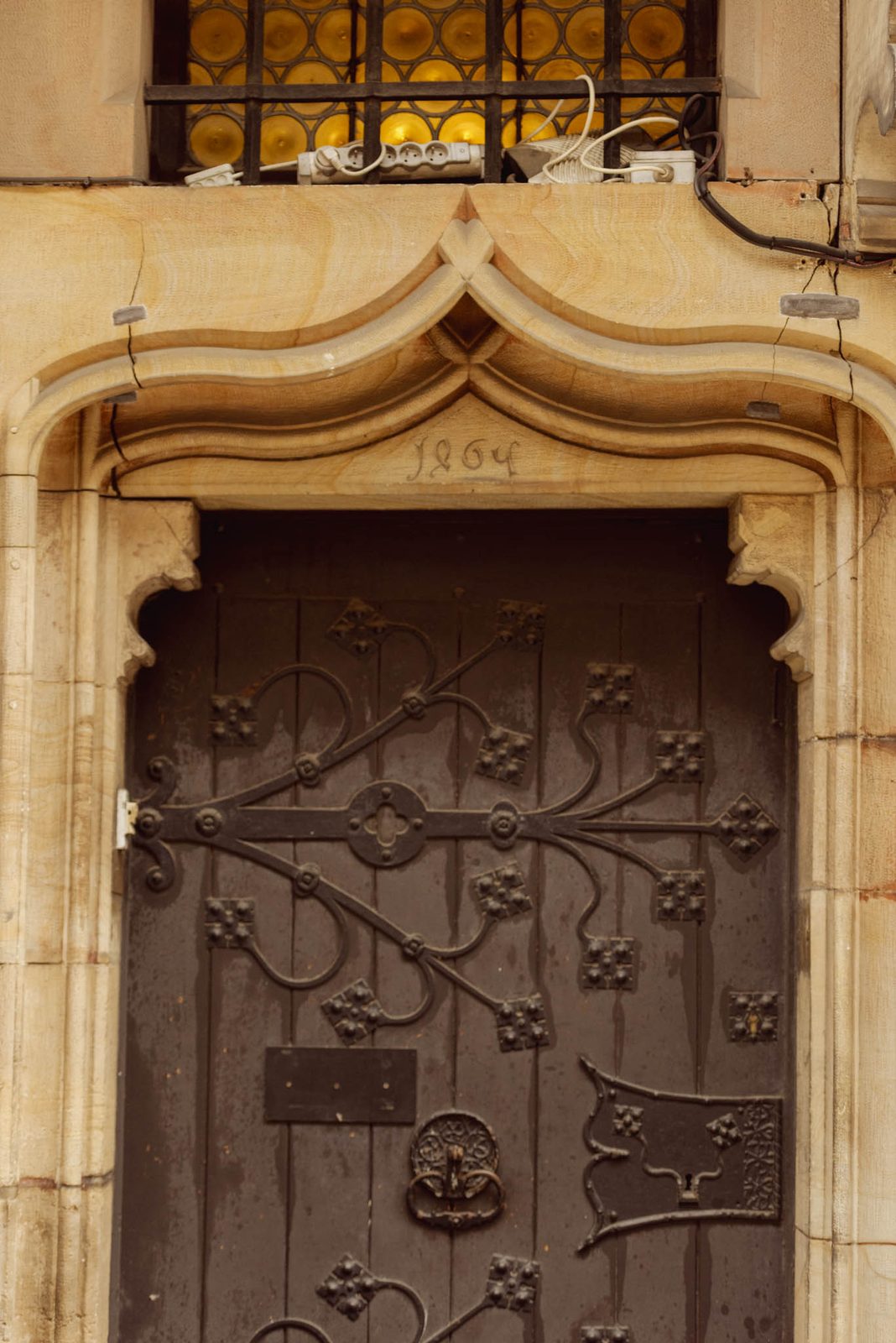 An old carved wooden door with iron fittings near Strasbourg Cathedral